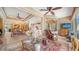 Open-concept living room with views into the kitchen and dining areas, showcasing seamless living at 8183 Nice Way, Sarasota, FL 34238