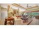 Spacious living room with elegant decor, recessed lighting, and tile flooring at 8183 Nice Way, Sarasota, FL 34238