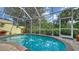 Enjoy the refreshing pool surrounded by lush tropical landscaping at 8183 Nice Way, Sarasota, FL 34238