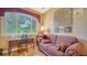 Cozy sitting area with a comfortable couch, desk and a large window overlooking the outdoors at 8183 Nice Way, Sarasota, FL 34238