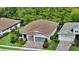 This beautiful home features a well-manicured lawn and professional landscaping, offering fantastic curb appeal at 8668 Sundance Loop, Sarasota, FL 34238