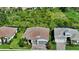 Aerial view of a single-Gathering home with a tile roof, well-maintained landscaping, and a paver driveway at 8668 Sundance Loop, Sarasota, FL 34238