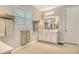 Bright bathroom featuring double sinks and a spacious layout, offering comfort and style at 8668 Sundance Loop, Sarasota, FL 34238