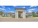 Attractive community center showcasing a modern entrance and manicured grounds at 8668 Sundance Loop, Sarasota, FL 34238