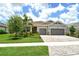 Charming single-Gathering home featuring a well-manicured lawn, mature landscaping, and a two-car garage at 8668 Sundance Loop, Sarasota, FL 34238