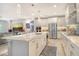 Gourmet kitchen with a center island, stainless steel appliances, and an open view to the living area at 8668 Sundance Loop, Sarasota, FL 34238