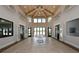Bright lobby with vaulted ceilings, tile floors, and modern fixtures at 8668 Sundance Loop, Sarasota, FL 34238