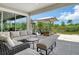 A well-designed outdoor patio offers a perfect space for relaxation and entertainment with stylish furniture and a view at 8668 Sundance Loop, Sarasota, FL 34238