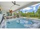 Outdoor patio features a hot tub, lounge furniture, and outdoor dining area with lovely view at 8668 Sundance Loop, Sarasota, FL 34238