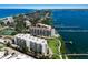 Spectacular aerial view of luxury condominiums, with boat docks and scenic waterfront vistas at 8735 Midnight Pass Rd # 602B, Sarasota, FL 34242