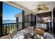 Charming balcony with water views, comfortable seating, and a ceiling fan for year-round enjoyment at 8735 Midnight Pass Rd # 602B, Sarasota, FL 34242