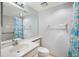Bathroom featuring bright lighting, a neutral color scheme, and a shower-tub combo with a colorful curtain at 8735 Midnight Pass Rd # 602B, Sarasota, FL 34242