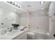 Bathroom featuring a clean white vanity, ample mirror space, and a shower-tub combination at 8735 Midnight Pass Rd # 602B, Sarasota, FL 34242