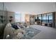 Comfortable living room with plush sofa, glass coffee table, decorative rug, and sliding doors to the balcony at 8735 Midnight Pass Rd # 602B, Sarasota, FL 34242