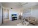 Inviting living room featuring neutral tones, a ceiling fan, and comfortable seating arrangements at 8735 Midnight Pass Rd # 602B, Sarasota, FL 34242