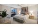 Bright bedroom with balcony access, a ceiling fan, and neutral colors offering a serene atmosphere at 8735 Midnight Pass Rd # 602B, Sarasota, FL 34242
