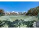 Well-maintained tennis courts offer an active lifestyle with views of palm trees and a beautiful community backdrop at 8735 Midnight Pass Rd # 602B, Sarasota, FL 34242