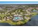 Aerial view of the community showcasing the pool, playground, clubhouse, lakes, and walking paths at 8985 Royal River Cir, Parrish, FL 34219