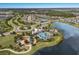 Community aerial view showcasing pool, lake, walking path, playground, and clubhouse at 8985 Royal River Cir, Parrish, FL 34219