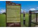 Signage displaying rules and information for Dash's Bark Park, a community dog park in Florida at 8985 Royal River Cir, Parrish, FL 34219