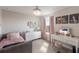 Bright bedroom with a comfortable bed, stylish decor, and a vanity area at 8985 Royal River Cir, Parrish, FL 34219