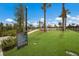 Outdoor bike park area with a pump track, surrounded by lush greenery and palm trees, offering recreational fun at 8985 Royal River Cir, Parrish, FL 34219