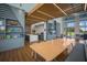 Inviting break room with a wooden ceiling feature, a large table, and a kitchenette for staff to enjoy at 8985 Royal River Cir, Parrish, FL 34219