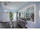 A community gym featuring free weights, kettle bells, workout benches, a large mirror, and a flat screen TV at 8985 Royal River Cir, Parrish, FL 34219