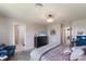 A tranquil main bedroom boasts a comfortable bed, dark dresser, and ensuite bath with a walk-in closet at 8985 Royal River Cir, Parrish, FL 34219