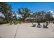 Outdoor seating area with comfortable chairs arranged around tables for relaxing, socializing, and enjoying the outdoors at 8985 Royal River Cir, Parrish, FL 34219