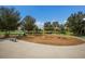 A large playground with a swing set, mulch, and a soft, green ground cover at 8985 Royal River Cir, Parrish, FL 34219