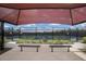 View of new community tennis courts with sun shade, benches, and landscaping at 8985 Royal River Cir, Parrish, FL 34219