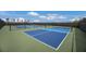 Newly built tennis courts with blue and green surfaces sit within the community at 8985 Royal River Cir, Parrish, FL 34219