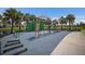 A community workout area next to the pond with several outdoor exercise stations and a scenic walking path at 8985 Royal River Cir, Parrish, FL 34219