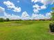 A large, green backyard with a beautiful view of the surrounding neighborhood at 10120 Carnoustie Pl, Bradenton, FL 34211