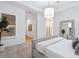 Bedroom view showing the entrance, a mirror, a ladder, and neutral colors at 10120 Carnoustie Pl, Bradenton, FL 34211