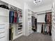 Large walk-in closet with custom shelving and ample storage space at 10120 Carnoustie Pl, Bradenton, FL 34211