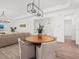 Open-concept design showcasing a dining area seamlessly connected to a well-lit living space at 10120 Carnoustie Pl, Bradenton, FL 34211