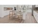 Bright kitchen featuring an island with barstool seating and stainless steel appliances at 10120 Carnoustie Pl, Bradenton, FL 34211