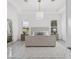 Spacious main bedroom with tray ceiling, neutral decor and large windows at 10120 Carnoustie Pl, Bradenton, FL 34211