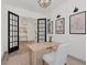 Well-lit office space with modern lighting, light-colored wood flooring, and stylish decor at 10120 Carnoustie Pl, Bradenton, FL 34211