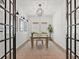 Office with a wooden desk, neutral carpet, modern lighting, and French doors at 10120 Carnoustie Pl, Bradenton, FL 34211