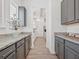 Walk-in pantry features gray cabinets, light countertops, and wood look tile flooring at 10120 Carnoustie Pl, Bradenton, FL 34211