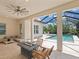 Covered patio with a fire pit, lounge furniture, and an open view of the pool area at 10120 Carnoustie Pl, Bradenton, FL 34211