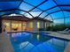 Sparkling screened pool with a spa and ample space for outdoor entertaining at 10120 Carnoustie Pl, Bradenton, FL 34211