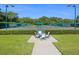 Scenic tennis courts with manicured landscaping and blue skies, offering a beautiful outdoor recreational space at 10120 Carnoustie Pl, Bradenton, FL 34211