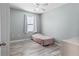Comfortable bedroom featuring a bed, window with blinds, and neutral-toned walls and floors at 1107 22Nd E St, Palmetto, FL 34221