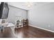Bright bedroom featuring dark wood flooring, bookshelf, and a ceiling fan for added comfort at 1107 22Nd E St, Palmetto, FL 34221