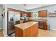 Well-equipped kitchen with stainless steel appliances, island, and abundant counter space at 1107 22Nd E St, Palmetto, FL 34221