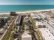 Aerial view of beachfront property with rooftop deck and inviting pool at 111 6Th N St, Bradenton Beach, FL 34217